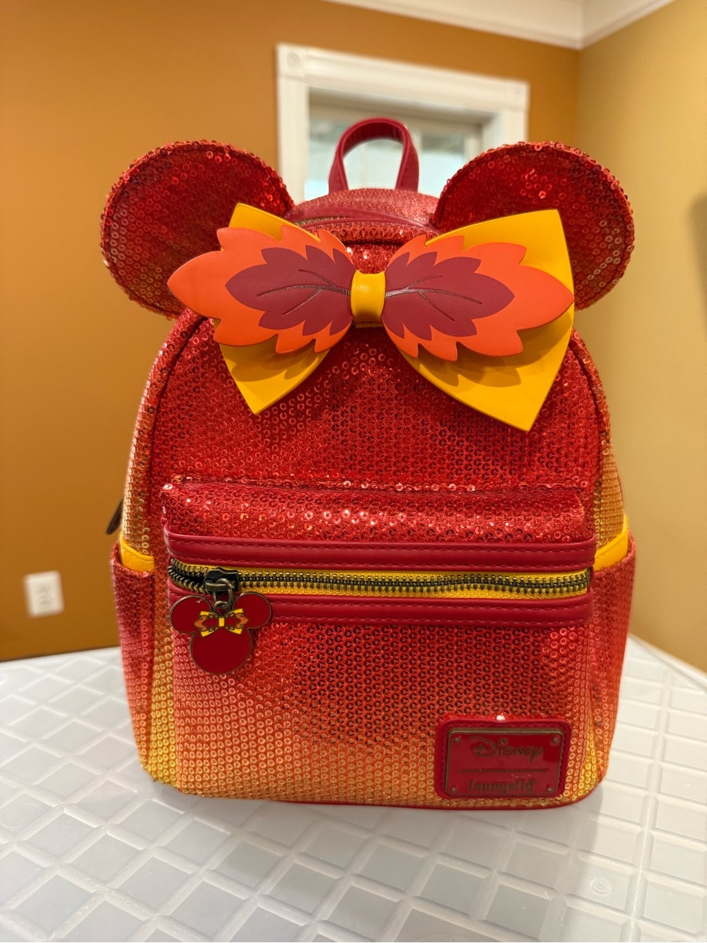 Loungefly Red Sequin Mini Backpack with Yellow-Orange Bow